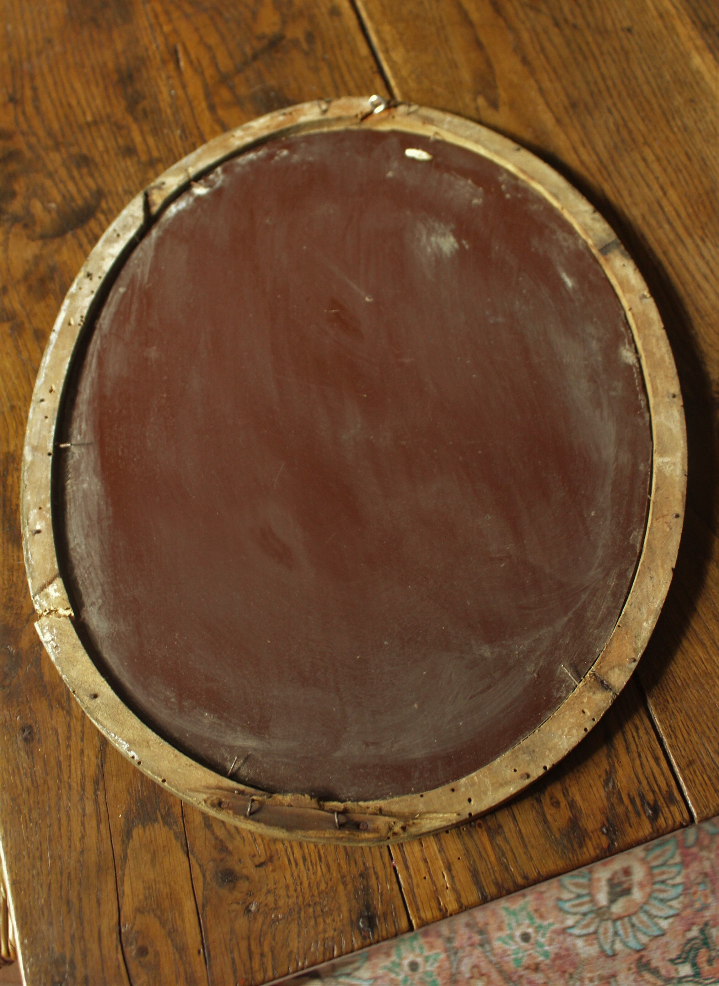 Old oval mirror gilded wood mercurized