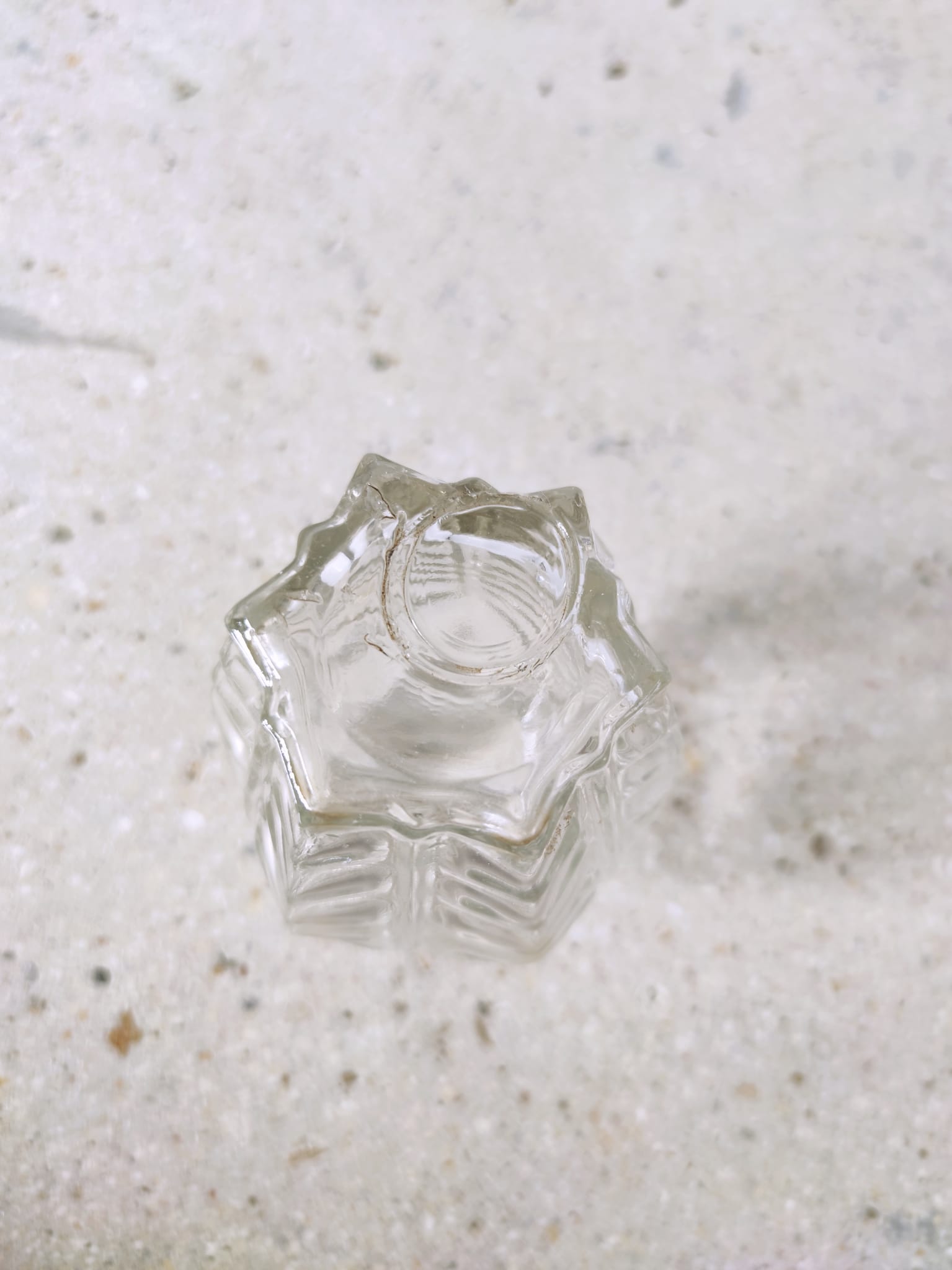 Small transparent molded glass vase