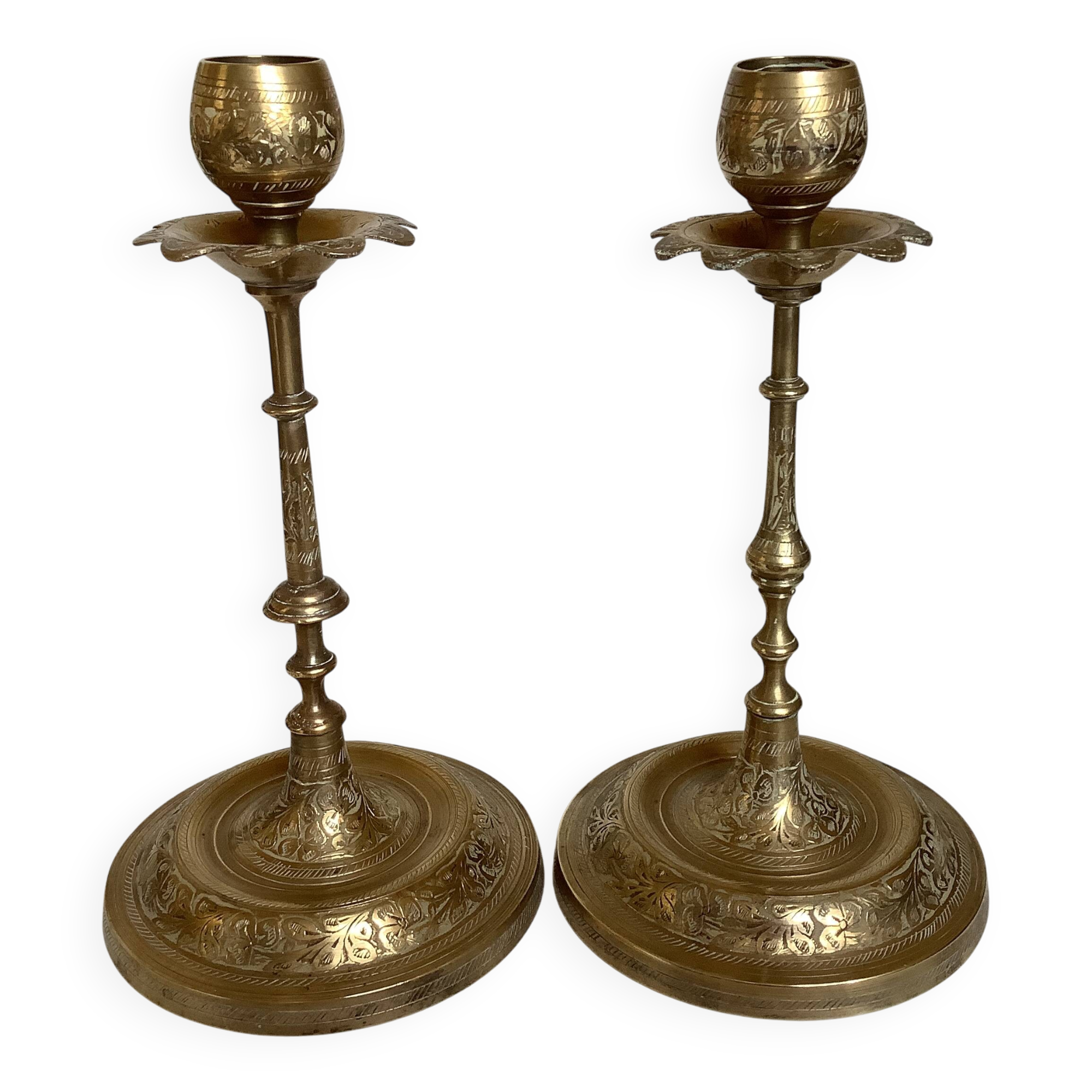 Pair of brass candlesticks with worked flower balls.