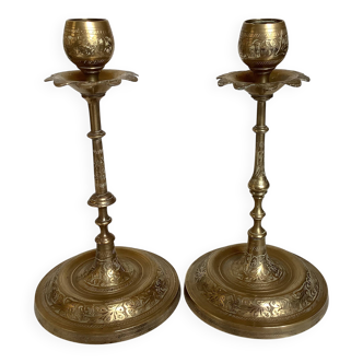 Pair of brass candlesticks with worked flower balls.