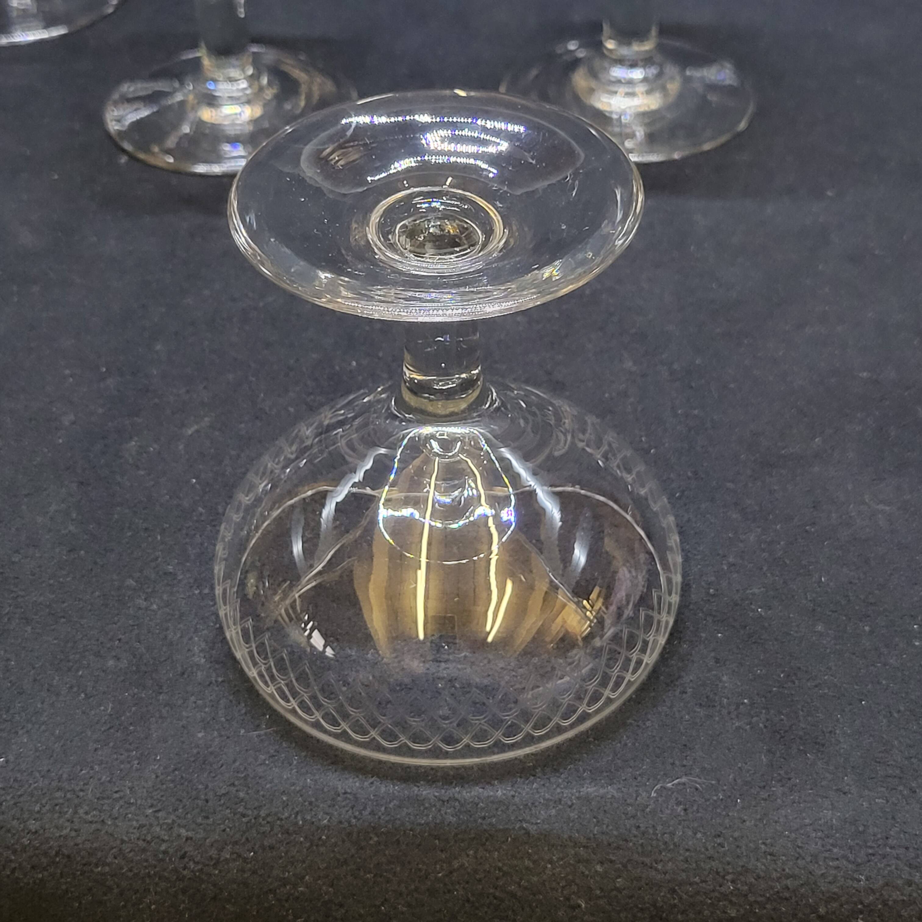 12 old champagne glasses in blown and engraved glass