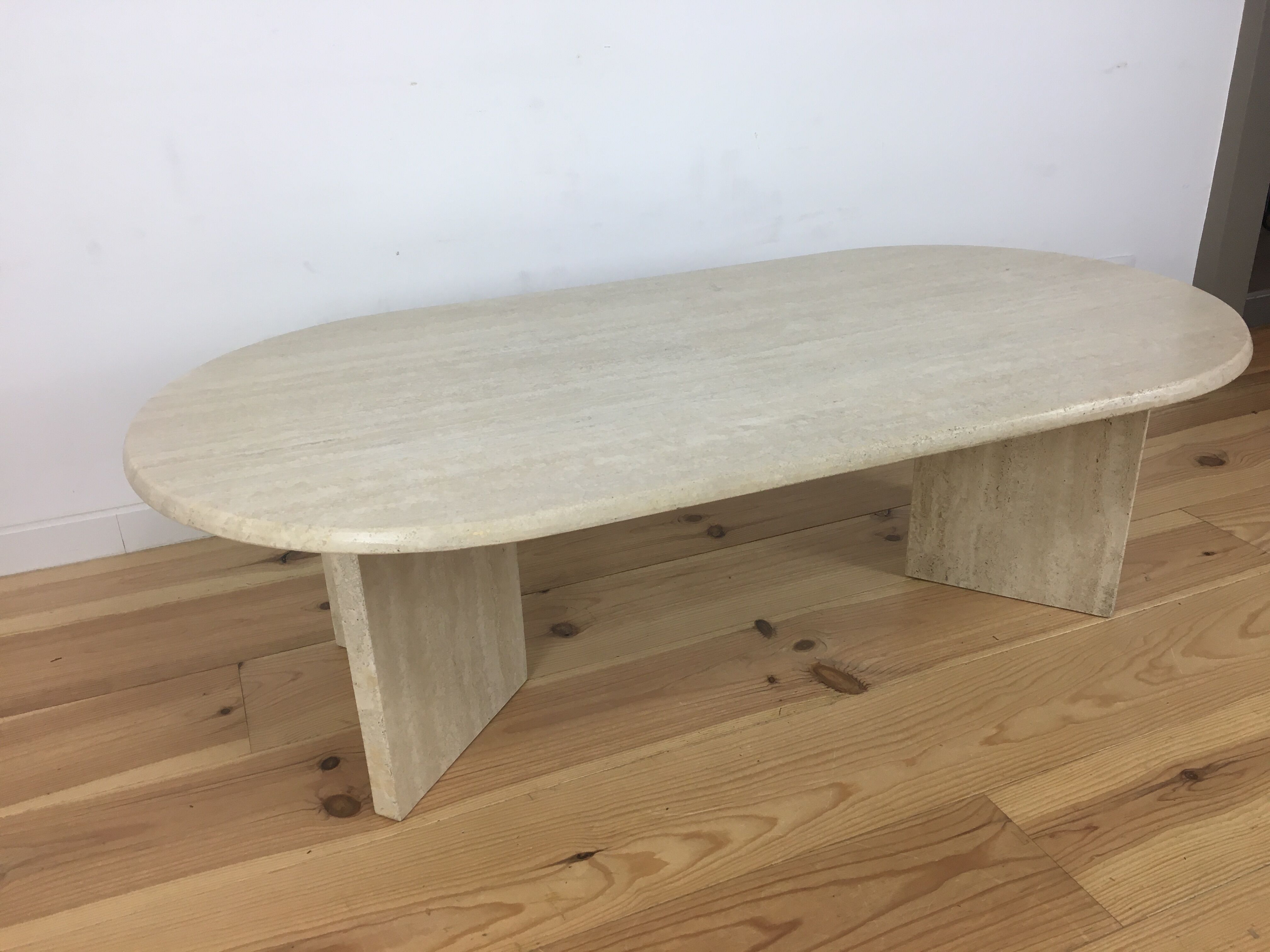 Oval coffee table in travertine