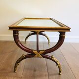 Coffee table in patinated and gilded carved wood with mirror top