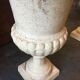 Pair of medicid vasques, cast, exterior