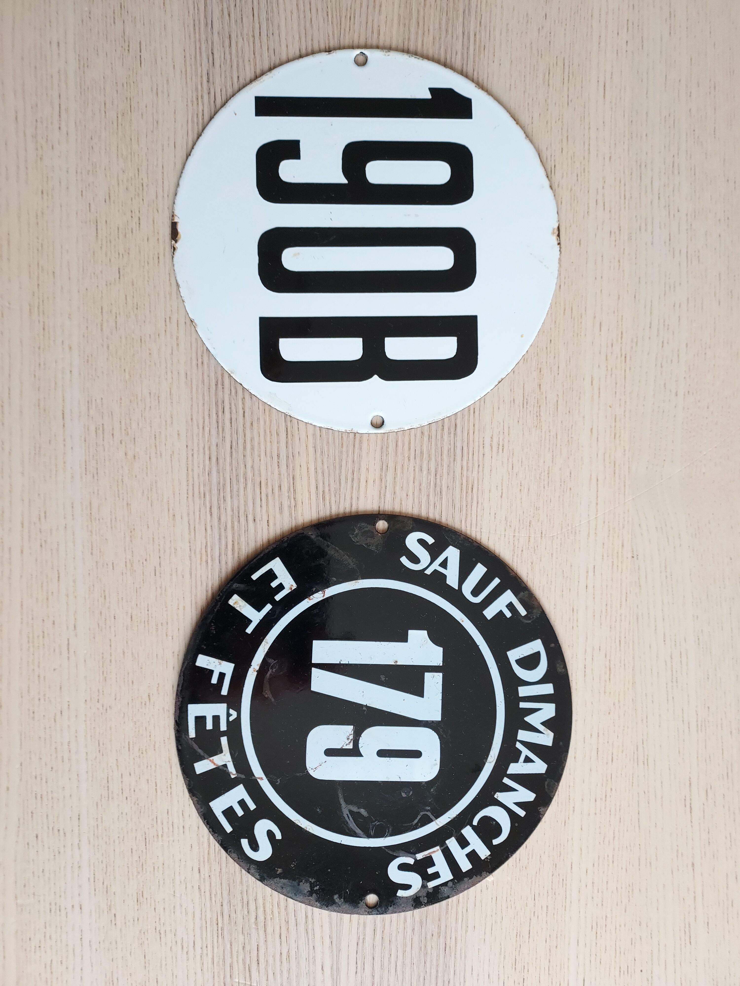 Enamelled city bus plates
