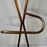 Coat rack on golden stand