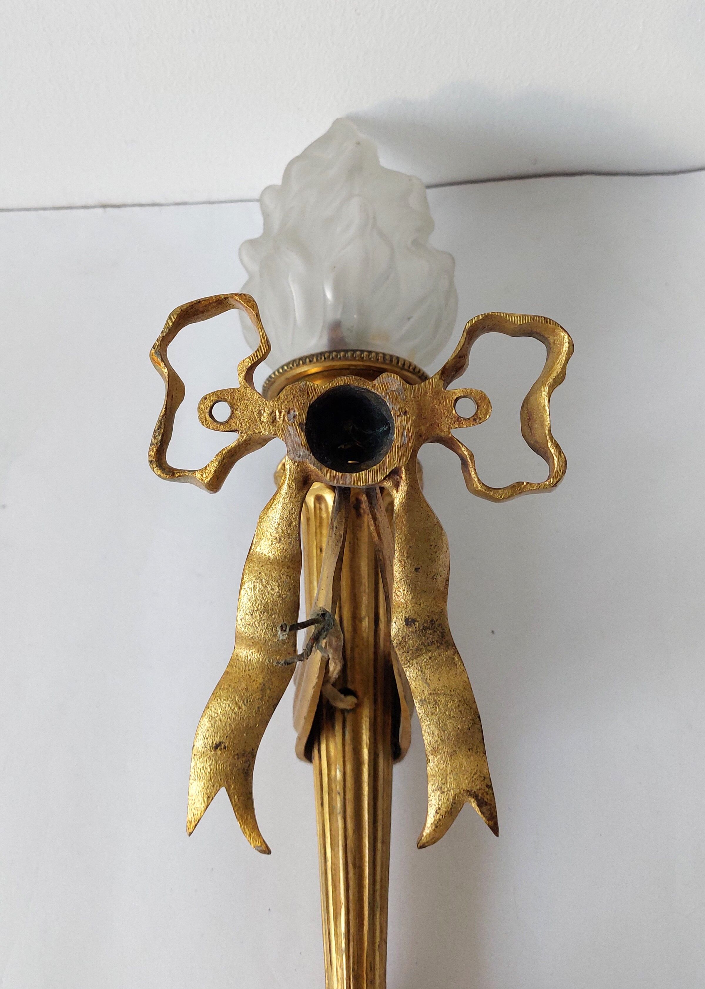 Torch wall lamp in gilded bronze Louis XVI Circa Napoleon III style.