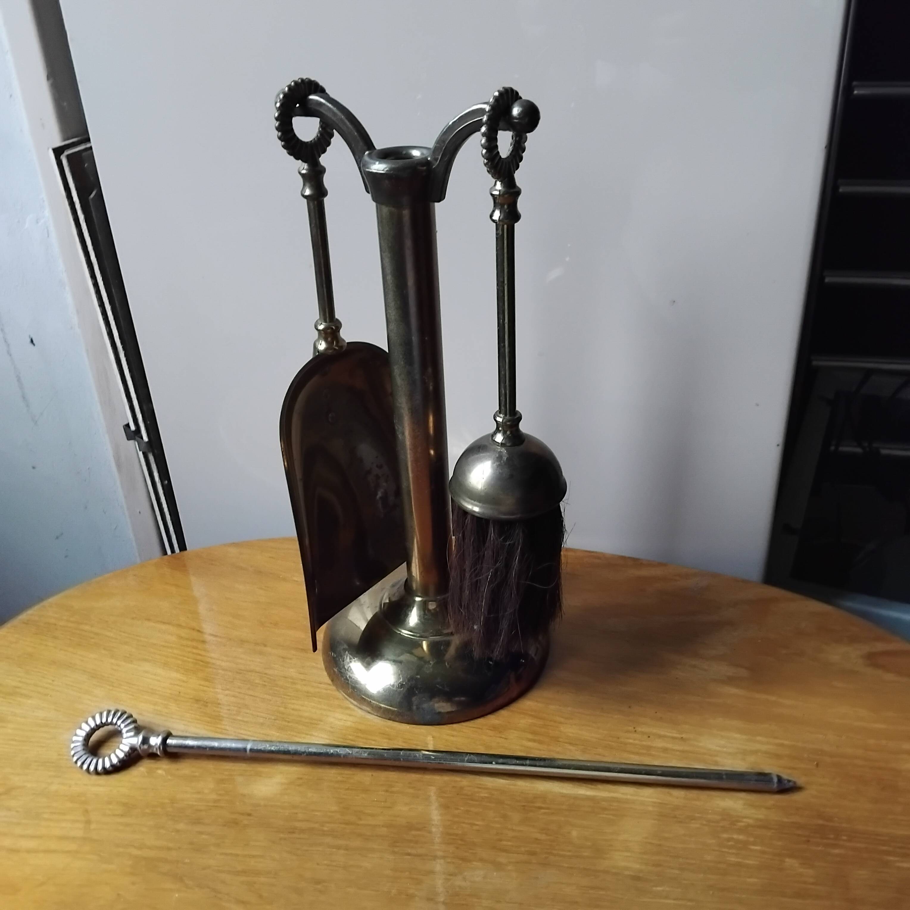 Small and discreet brass fireplace tool set.