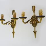Pair of double-light Empire style arrow wall lights in bronze. Early 20th century