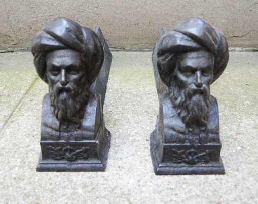 Pair of men's cast iron channels with turban