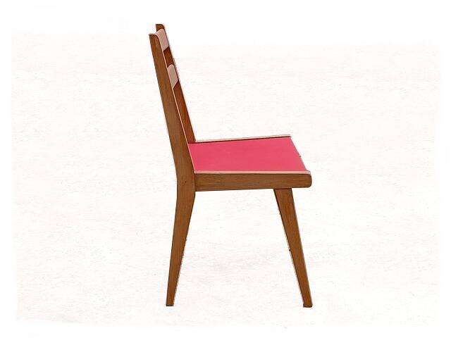 Vintage chairs from the 1950s in wood and faux leather.