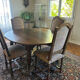 Solid oak dining table and 6 matching chairs.