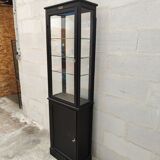 Old wooden window of black patina store two doors