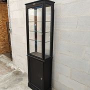 Old wooden window of black patina store two doors