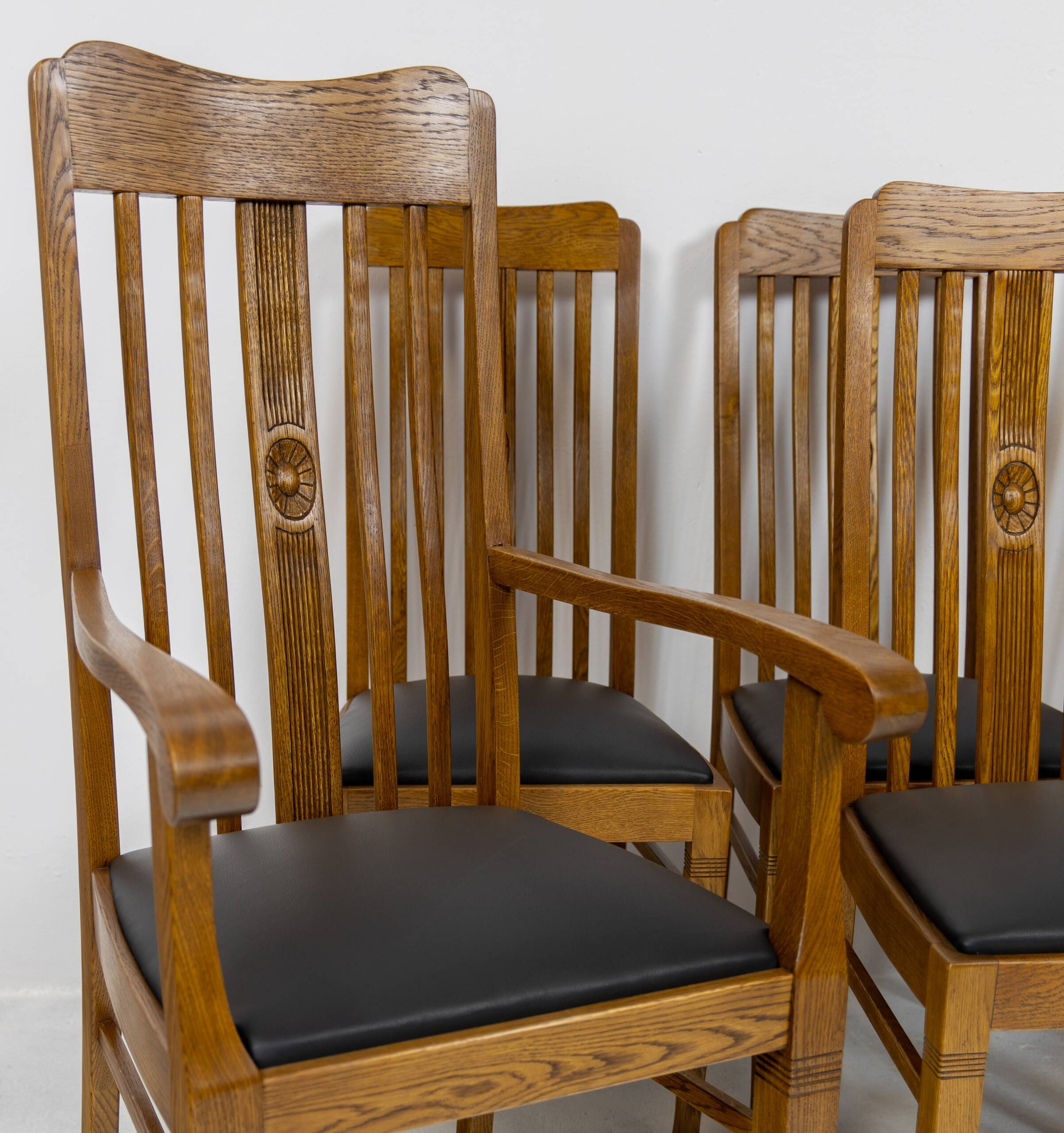 Set of 6 Art Nouveau chairs and armchairs in oak and leather.