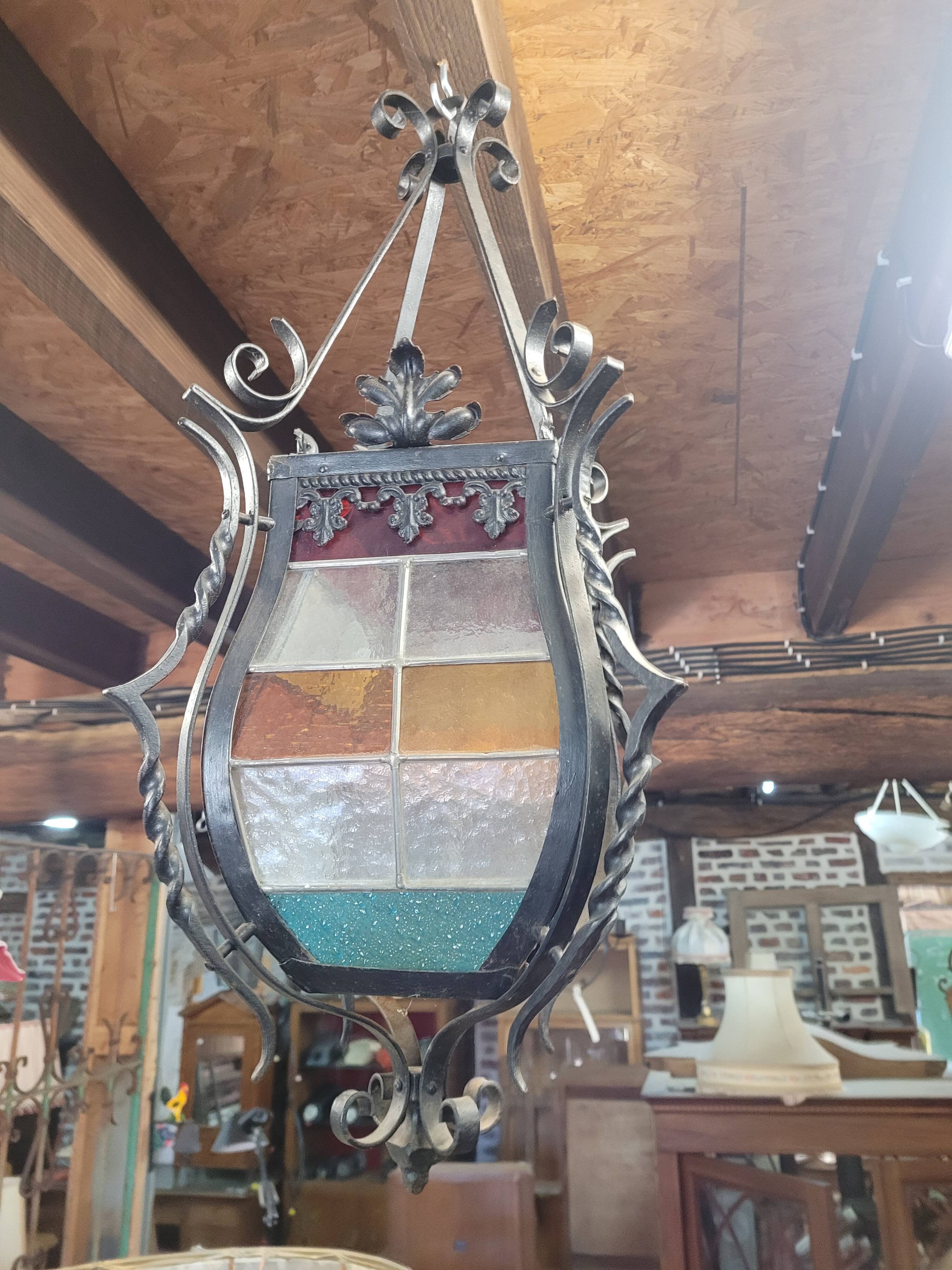 Wrought iron lantern with stained glass windows