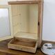 Small glass wall cabinet from the 1960s.