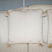 Three-seater canapé carved from solid walnut with claw feet.