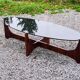 Designer coffee table by Hugues Poignant in rosewood and smoked glass from the 70s