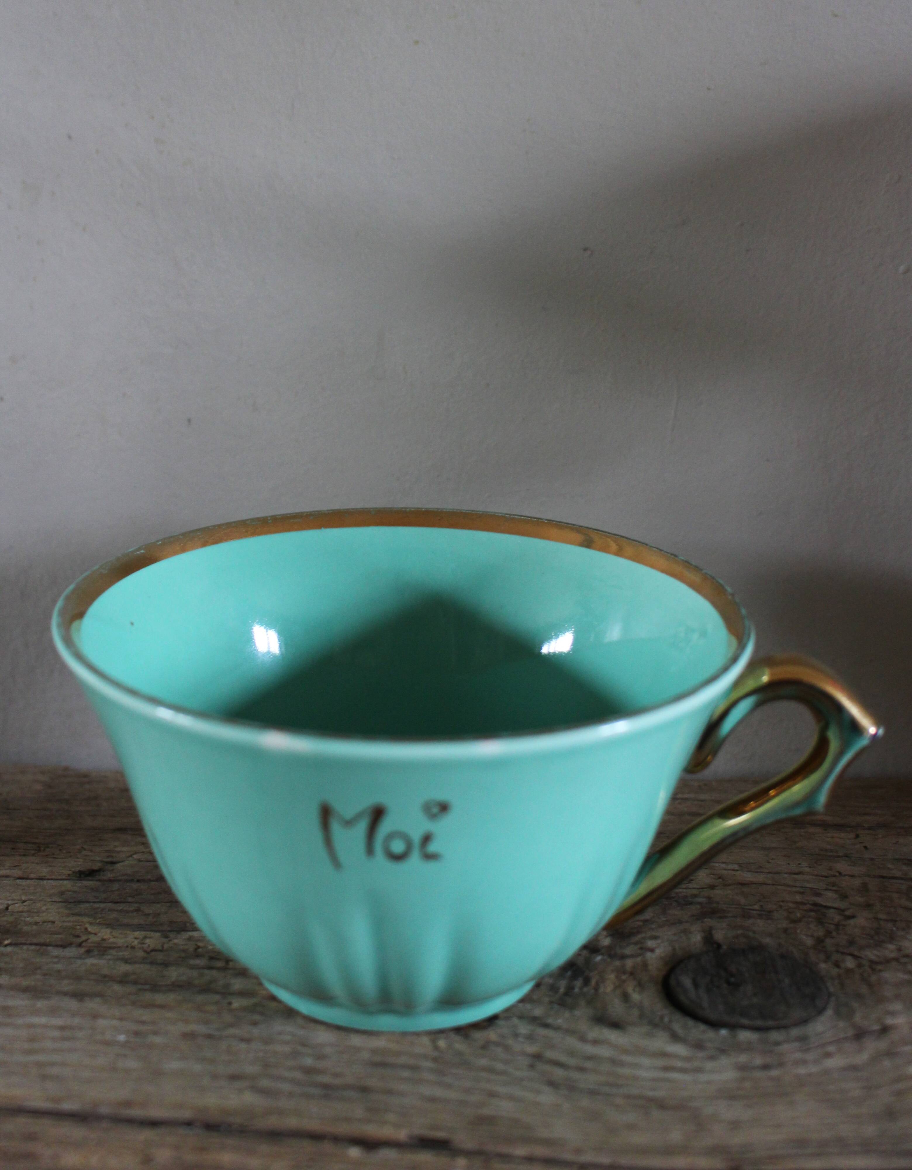 Green and gold cup from the Moi Salins collection.