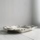 Decorative tray in sculpted white ceramic