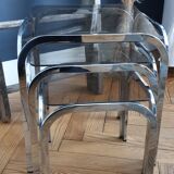 Trundle table in tubular steel and smoked glass
