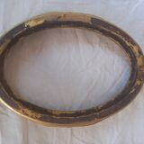 Stylized oval gold frame