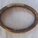 Stylized oval gold frame