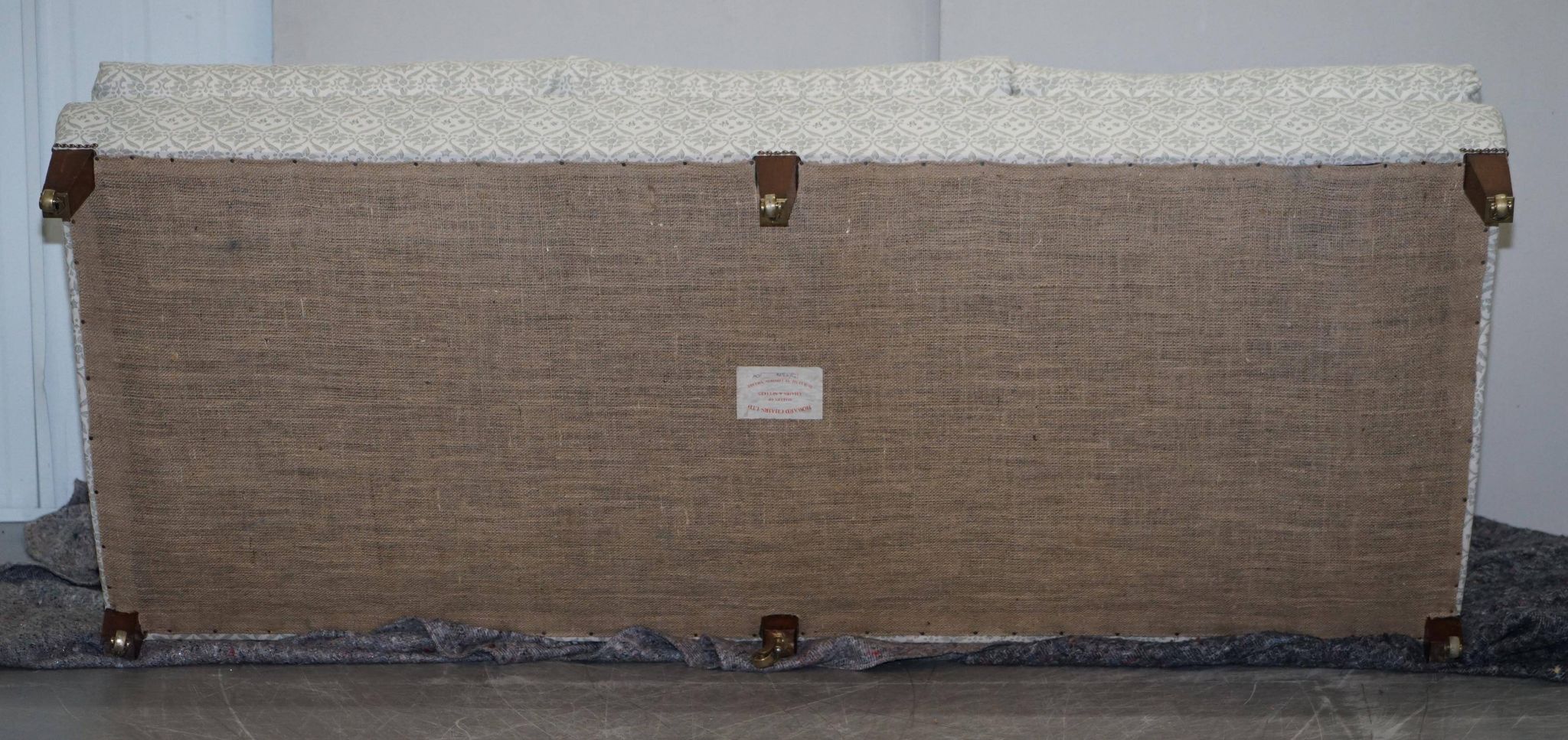 Howard & Sons canapé with feather cushions and ticking fabric, Victorian style.