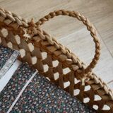 Doll bassinet with its bedding