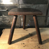 Wooden milking stool on tripod base