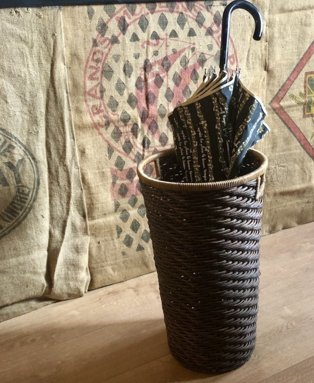 High basket in braided wicker