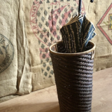 High basket in braided wicker