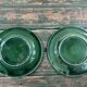 Pair of green slip plates with leaf decoration, 19th century