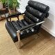Vintage 1970s black leather armchair – metal frame