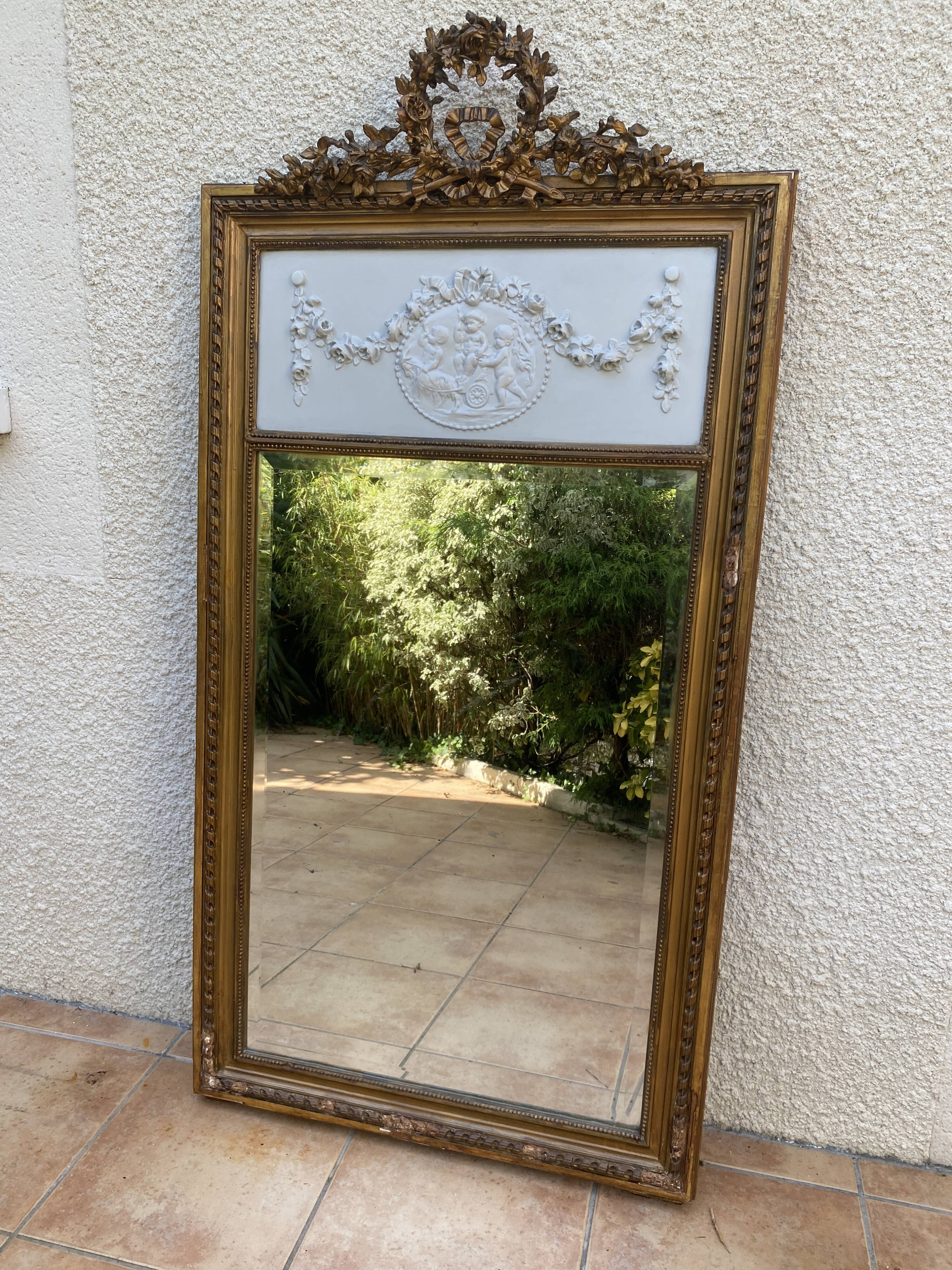 19th century Louis XVI style mirror in wood gilded with gold leaf, 74x150cm