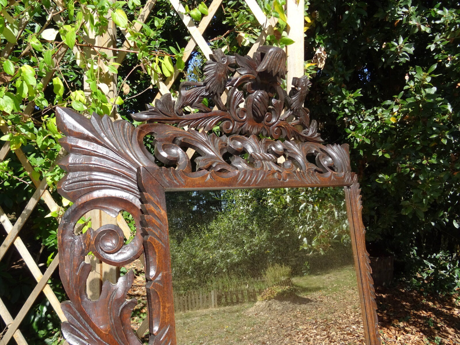 Miroir sculpté fronton lions