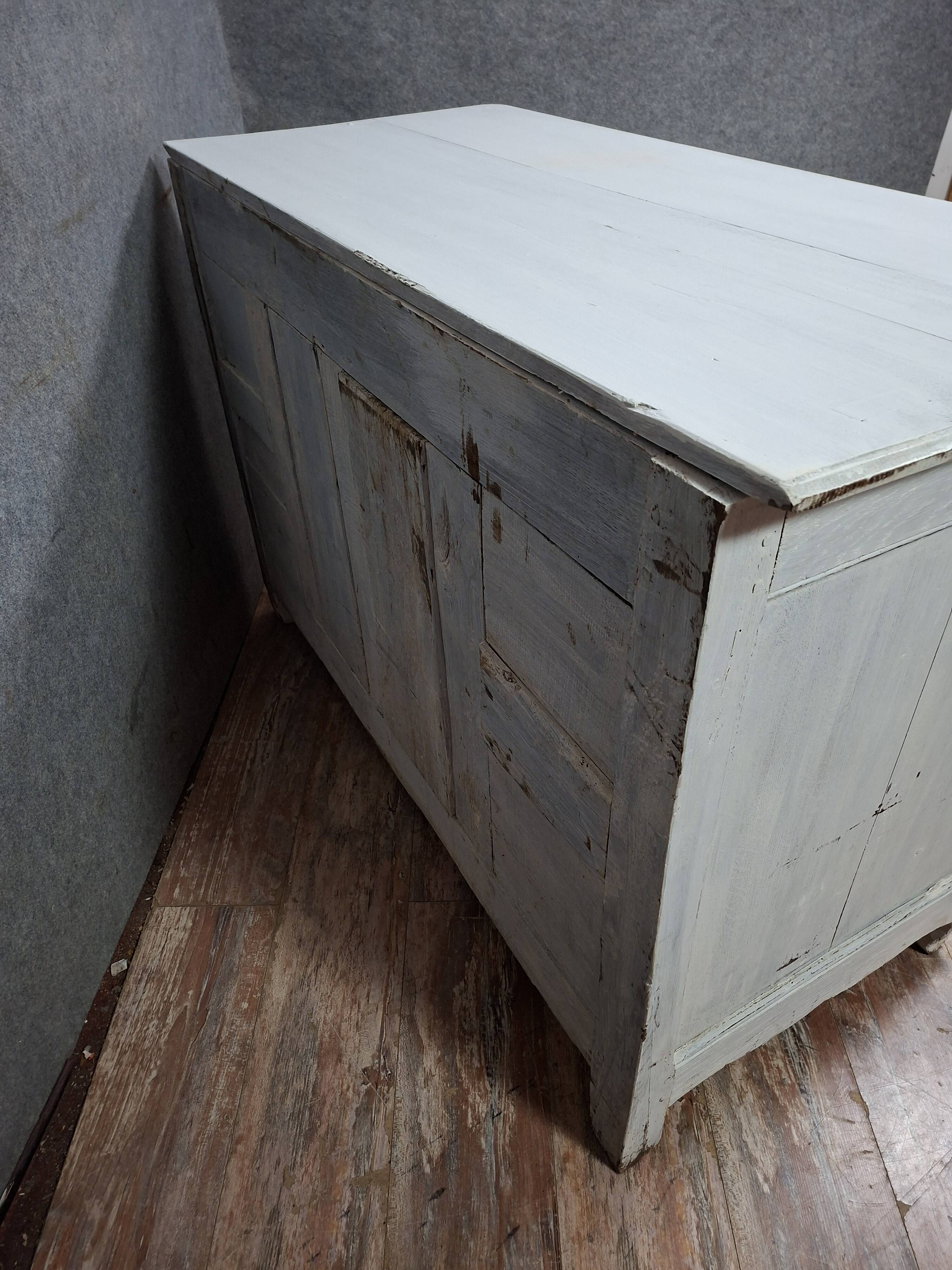 rustic buffet from the Louis XV period in natural wood with a distressed finish
