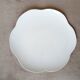 Large white multi-lobed pie or cake dish