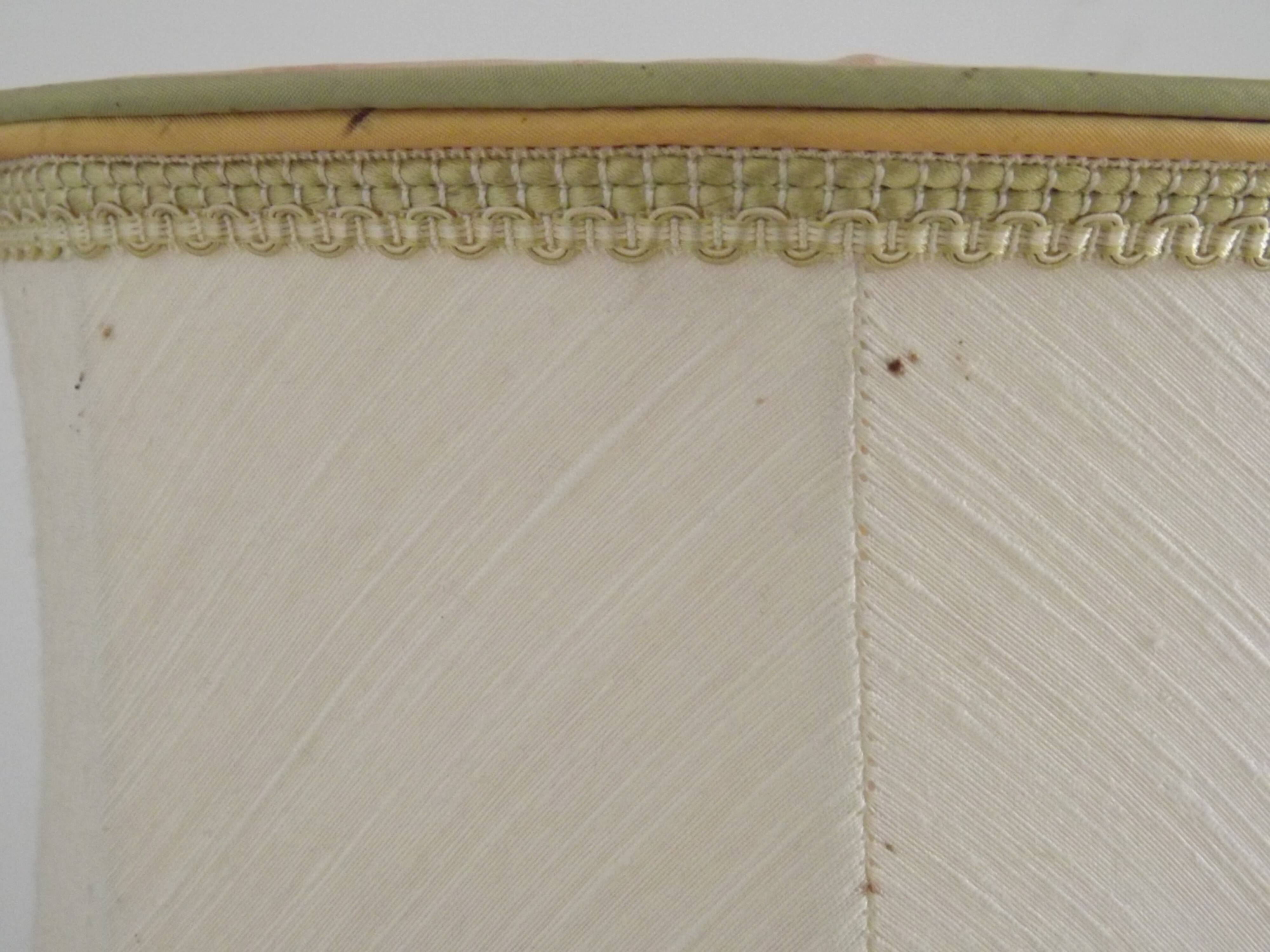 Table lamp with wooden base and fringed shade