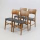 Set of 2 vintage Scandinavian chairs in teak and black faux leather by Kofod-Larsen, Denmark, 1960s.