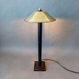 Post-Modern lamp in black metal and gilded brass.