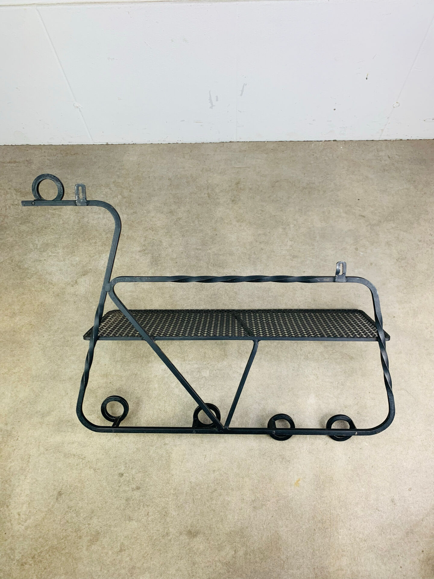 Wall-mounted coat rack/wardrobe from the 1950s, wrought iron and rigidule.