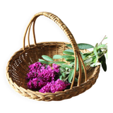 Round wicker basket with a rigid handle.