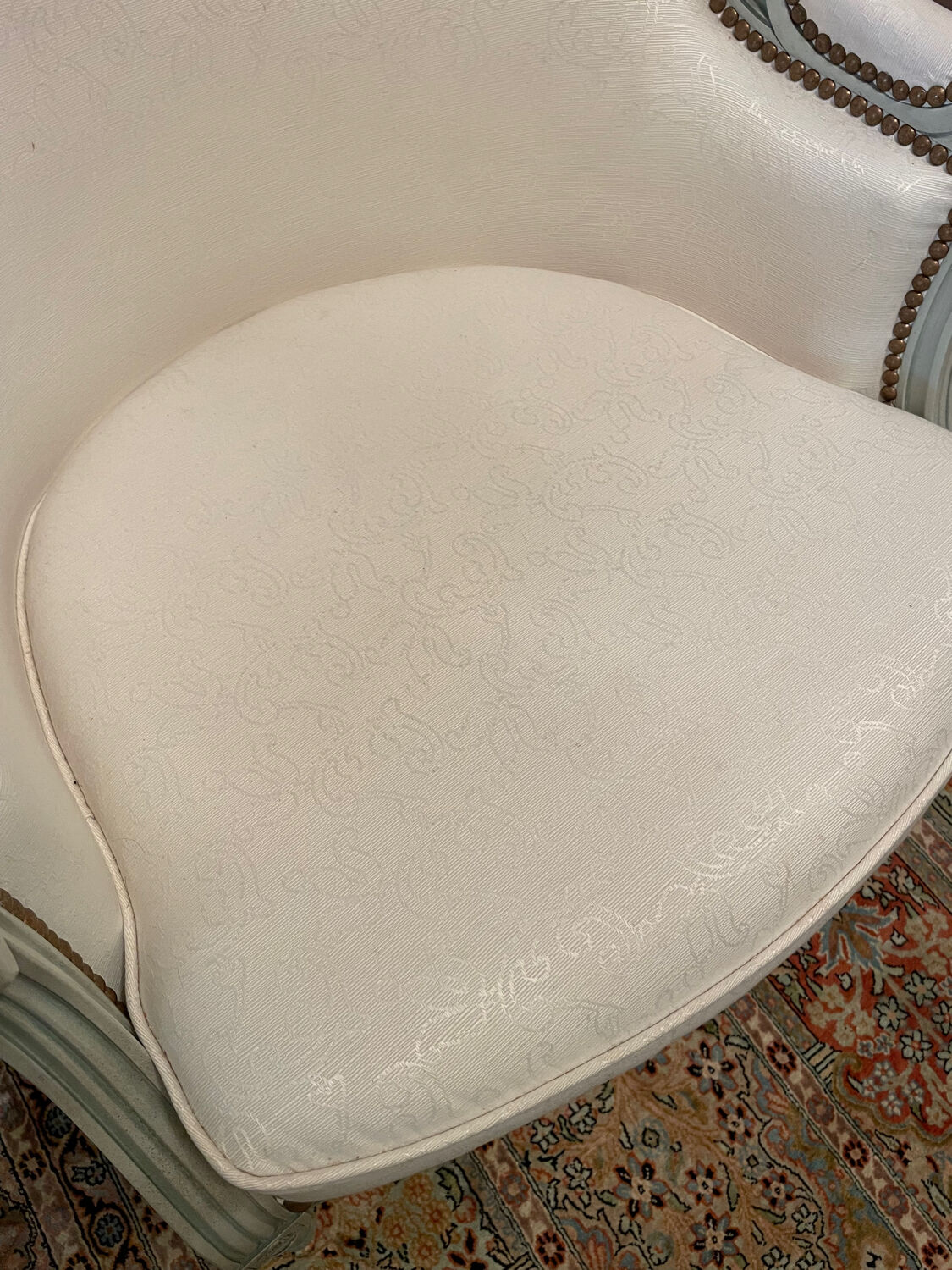 Armchair and 2 chairs set in Louis XVI style, light fabric, patinated wood.