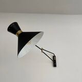 Articulated light in brass
