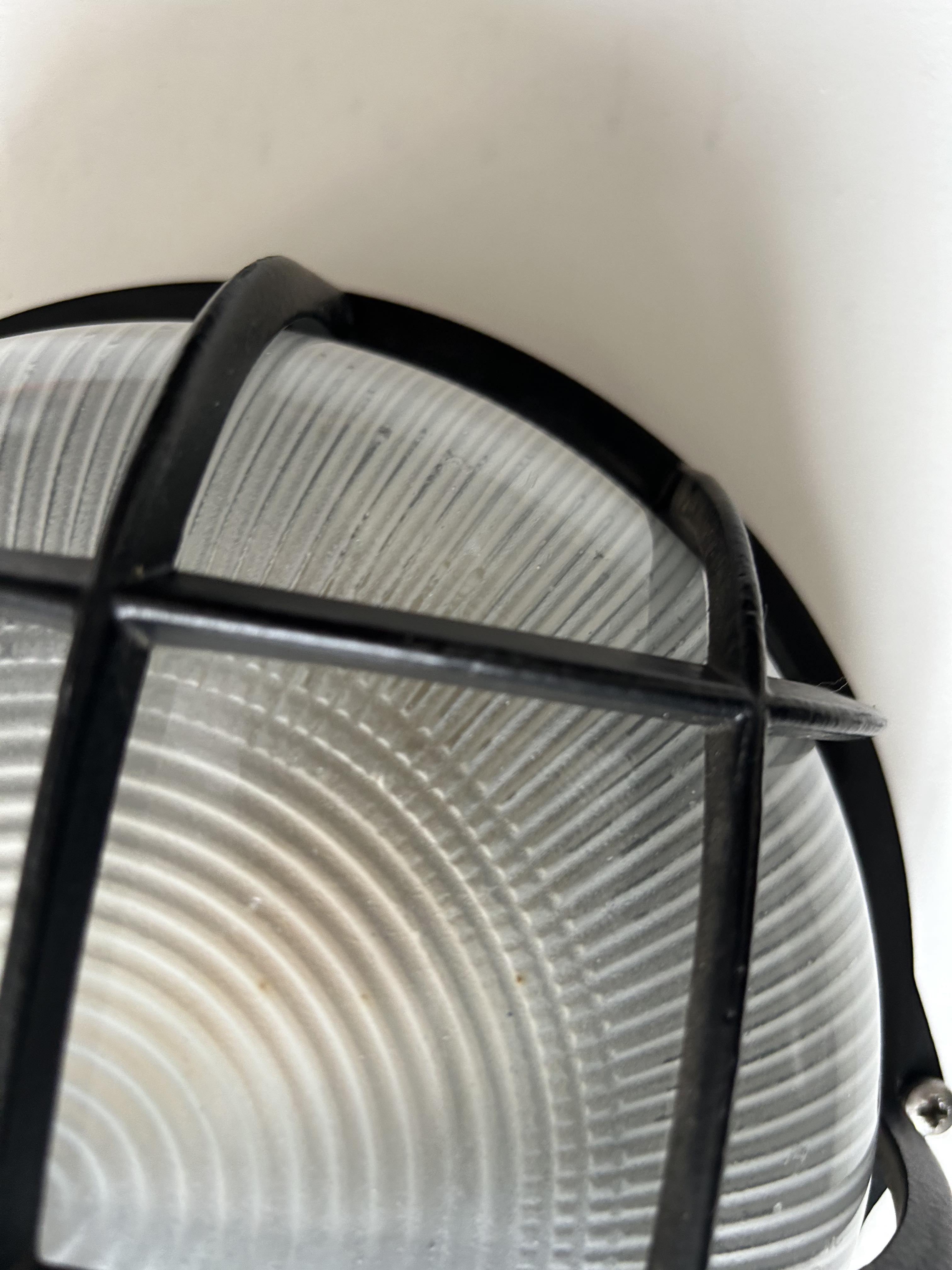 Vintage wall lamp, black metal and ridged glass, France 1980.