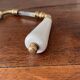 pair of porcelain handle levers with brass rods, antique