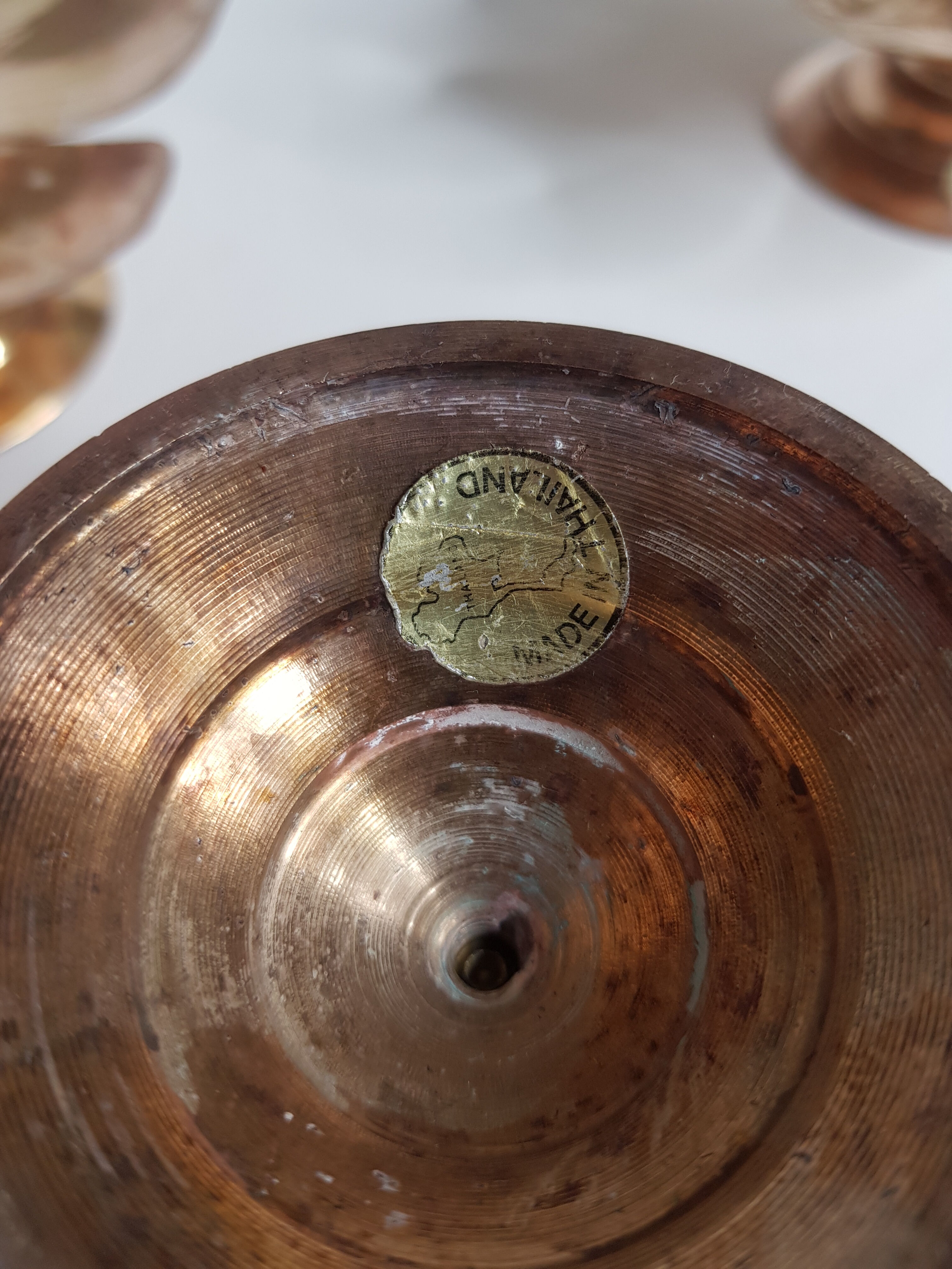 Set of four copper candlesticks in the shape of lotus flowers