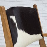 1960s, Danish highback armchair, genuine cowhide, oak wood, reupholstered.